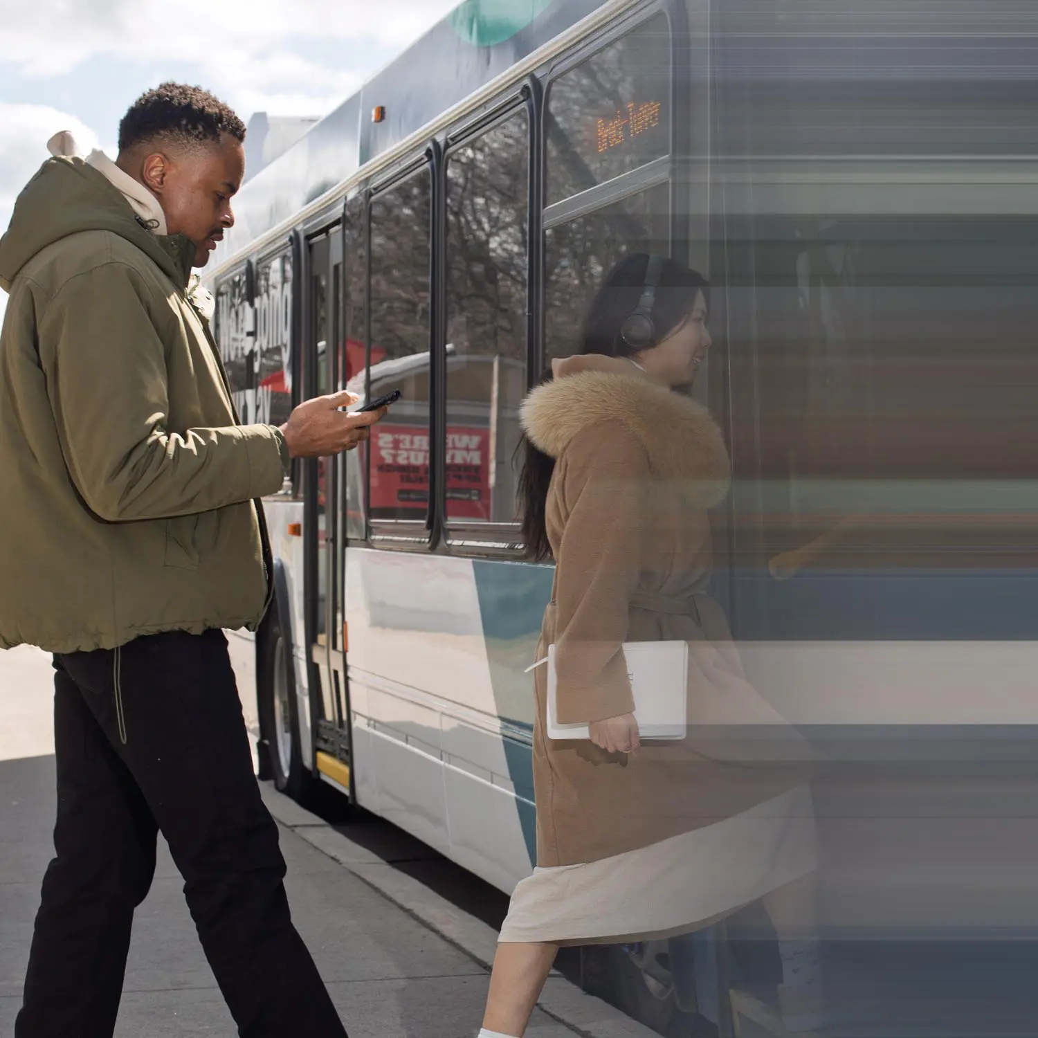 People boarding a bus.
